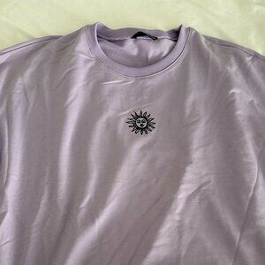 Lilac Purple Crewneck with Small Sun Design